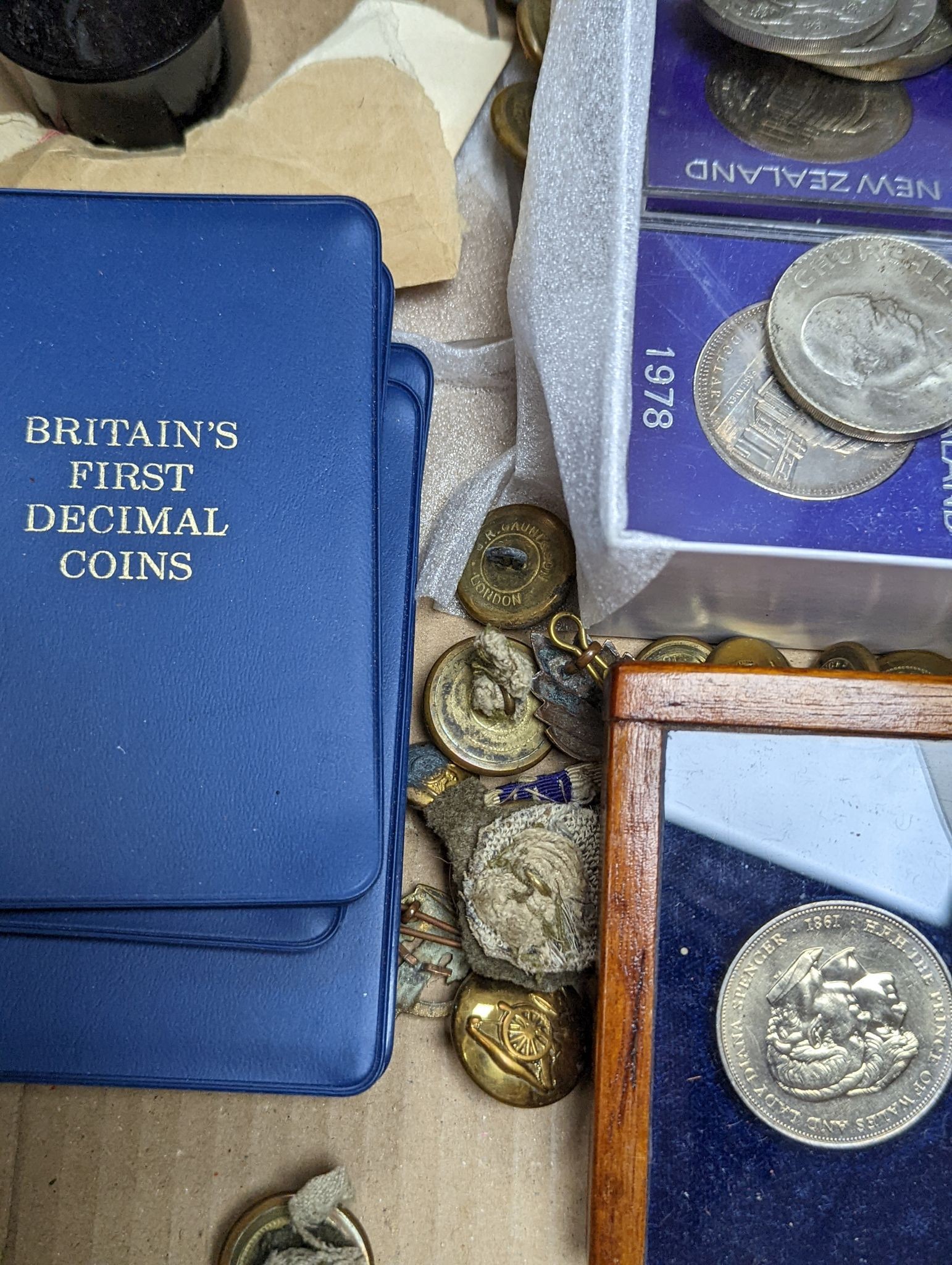 A collection of coins, commemorative Crowns, regimental buttons, etc.